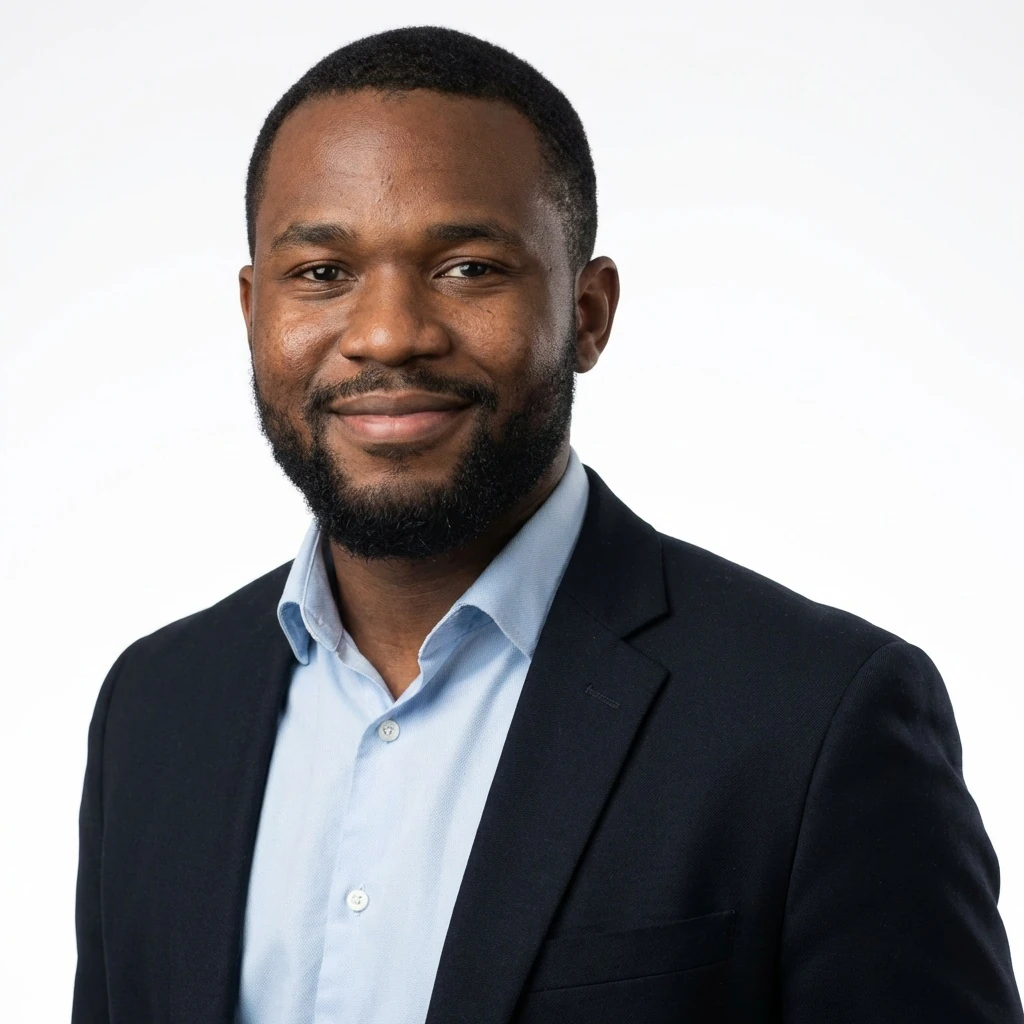 Headshot of a Dark-Skinned Man in Professional Attire